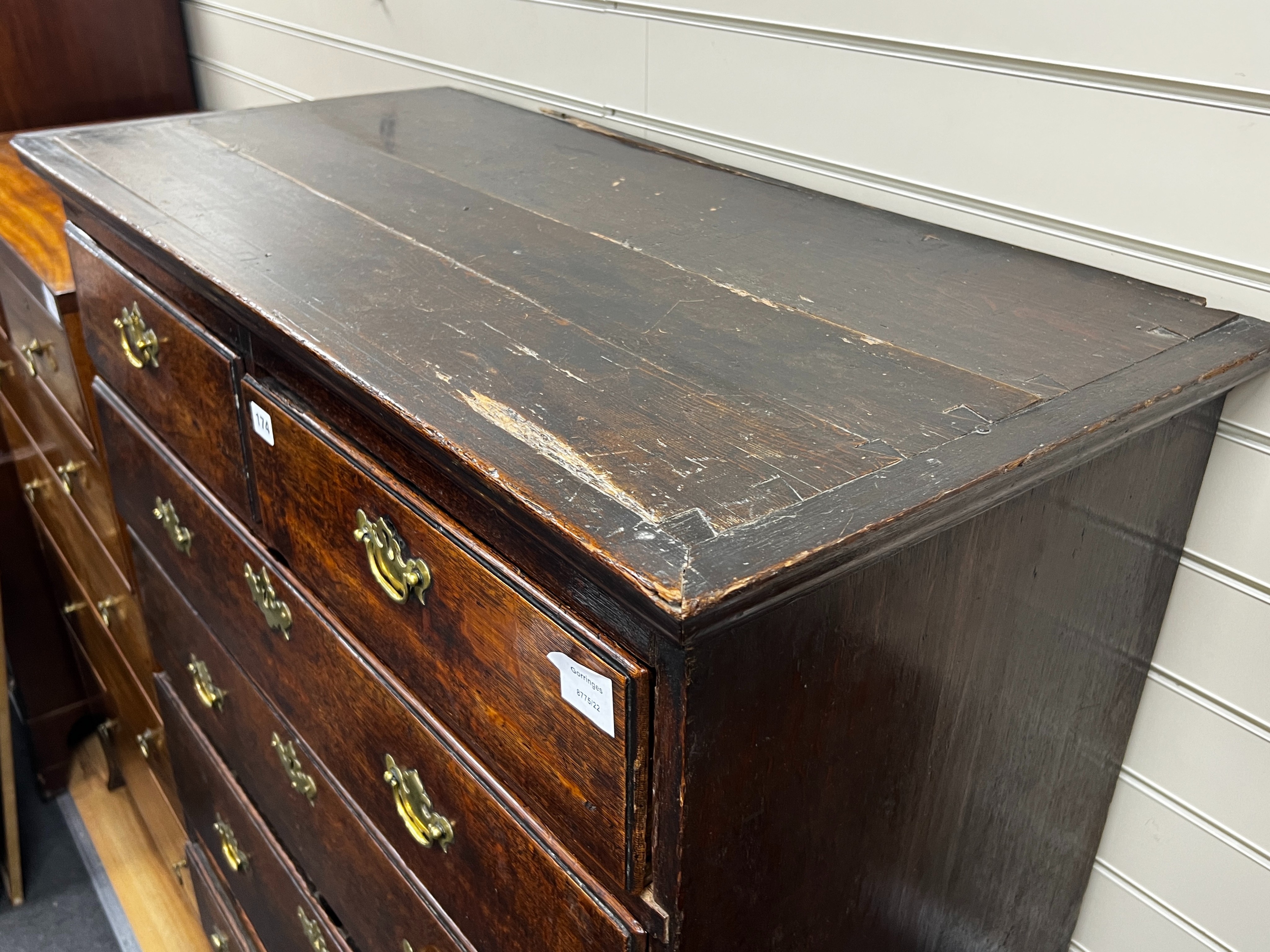 An 18th century oak chest on stand, width 99cm, depth 48cm, height 154cm